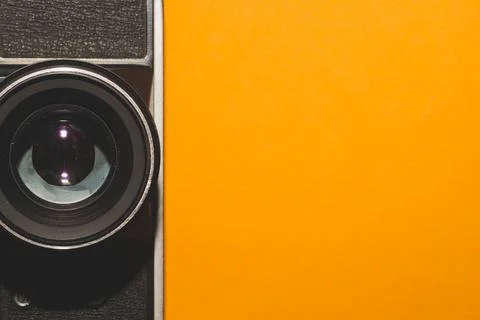 Analog camera on yellow background. copy space Stock Photos