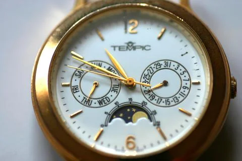 Analog clock clockwork dial close-up Foto stock
