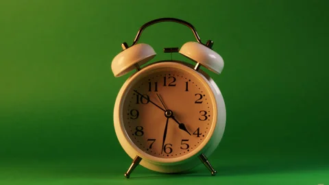 Analog clock goes on a green screen, timelapse, fast passage of time. Stock Footage 208013599