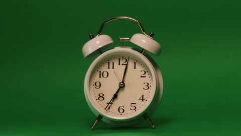 Analog clock goes on a green screen, timelapse, fast passage of time. Stock Footage 208016590