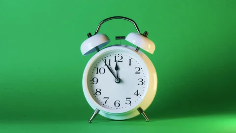 Analog clock goes on a green screen, timelapse, fast passage of time. Stock Footage 208024157