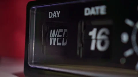 Analog flip calendar clock changing date close up, dark background, Stock Footage 342636961
