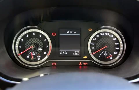 Analog instrument panel in a passenger car Stock Photos