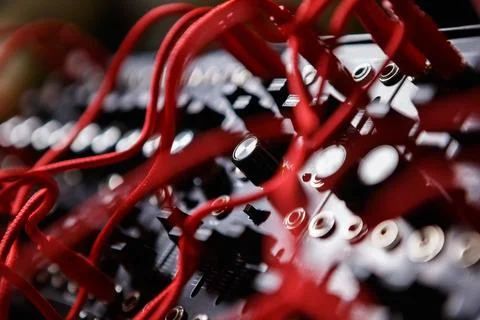 Analog modular synthesizer board connected with wires in sound recording st.. Stock Photos