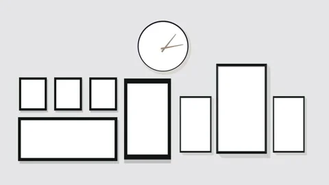 Analog office clock hanging on a gray color wall with blank photo frame Stock Footage 137934776