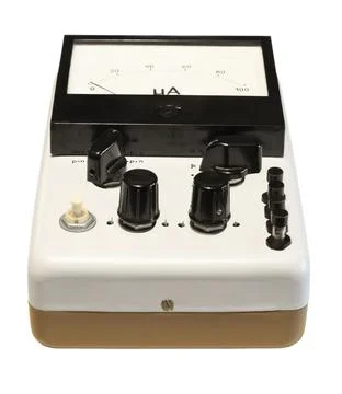 Analog old measuring and testing instrument. Isolated on a white background Stock Photos