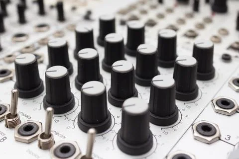Analog synthesizer , knobs macro on music equipment Stock Photos