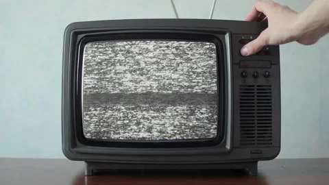 Analog TV with signal bad interference, switching channels Stock Footage 90163296