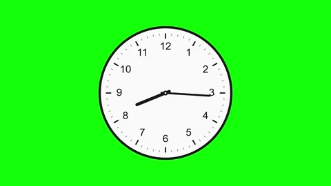 Analog wall clock face showing ten past three against a green screen time Stock Footage 347857785