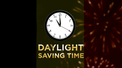 Analog wall clock showing time with glowing gold daylight saving time text Stock Footage 346541236