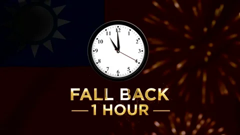 Analog wall clock showing time change with text fall back one hour and taiw.. Stock Footage 346541983