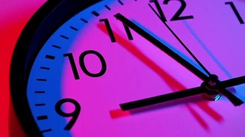 Analog wall clock. Time lapse wall clock with red and blue light. Clock running Video stock 304292524