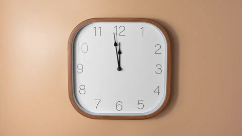 Analog wall clock timelapse on orange background showing fast time movement Stock Footage 330164851