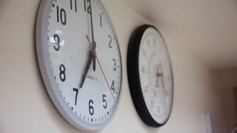 Analog wall clocks mounted on wall a hospital room, Chicago, Illinois, USA Stock Footage 202903515