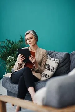 Analysing the data correctly. Cropped shot of an attractive mature businesswoman Stock Photos