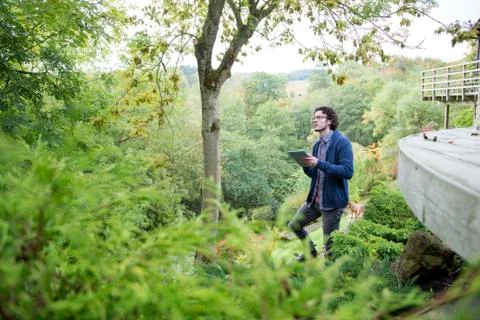 Analysing nature with digital tablet Stockfoto's