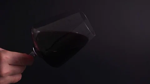 Analysis of alcohol in a glass - sommelier will check the color and smell of Stock Footage 125026034