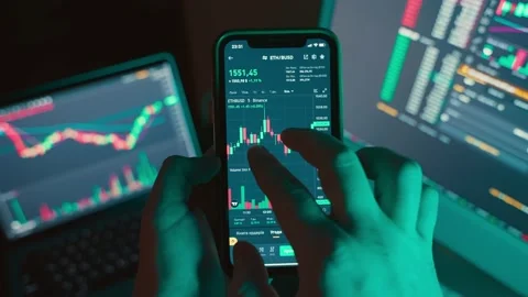 Analysis and study of financial markets on the screen of a mobile phone. Stock Footage 230966686