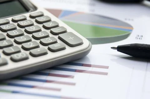 Analysis of data, chart and graphs with calculator and pen. Business financ.. Stock Photos