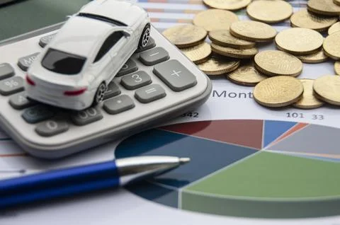 Analysis of data, chart and graphs with isolated calculator, gold coins and.. Stock Photos