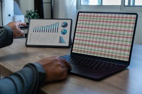 Analysis data man using a tablet to analysis chart marketing company financ.. Stock Photos