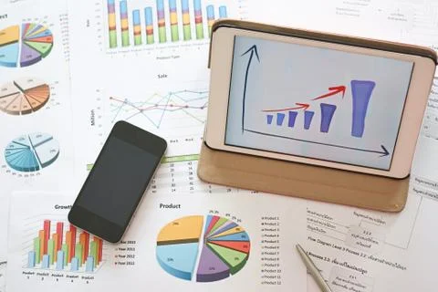 Analysis financial planning document with mobile phone Stock Photos