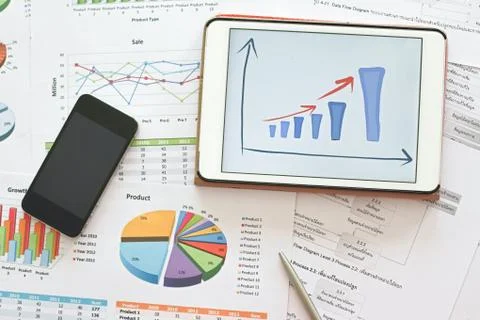 Analysis financial planning document with mobile phone Stock Photos