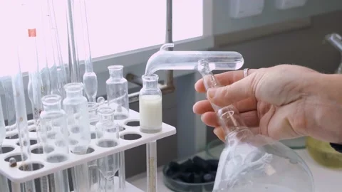 Analysis of milk in the laboratory. close-up of checking milk in the laboratory. Stock Footage 153141691