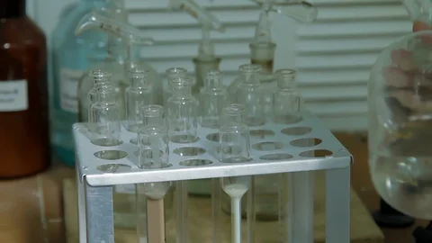 Analysis of milk sample on laboratory equipment. Modern equipment. Scientist put 스톡 동영상 125804986