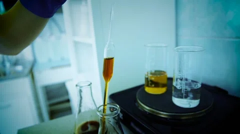 Analysis of oil or dark lager beer. Research lab assorted glassware equipment Video stock 65826058