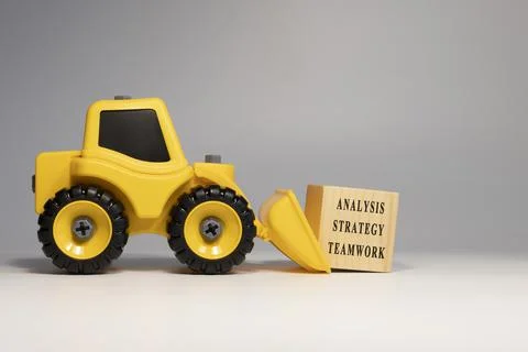 Analysis teamwork strategy written on the surface. Economy and education Stock Photos