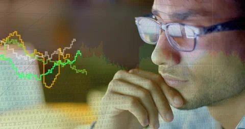 Analyst analyzing screen receiving and projecting charts reflecting in glasses Stock Photos
