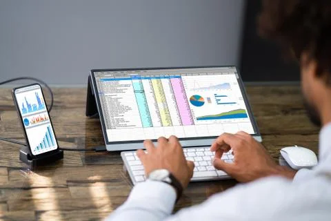 Analyst Employee Using Spreadsheet Software On Phone Stock Photos