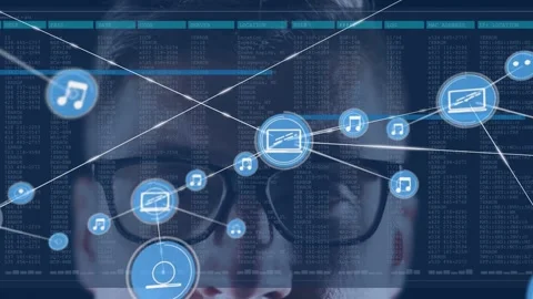 Analyst with glasses gazing ahead, blue node popping brow driving icon web over Stock Footage 333602280