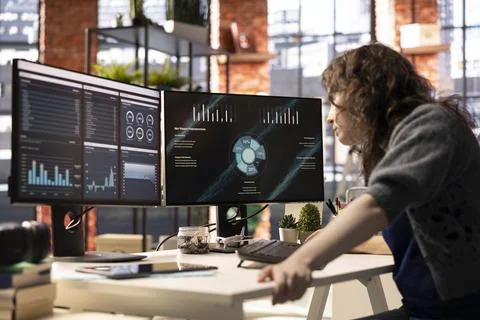 Analyst looking at presentation charts and dashboard to implement analytics Stock Photos