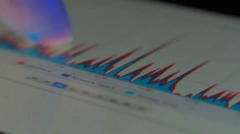 Analyst looking on the tablet the graphics to help the development Stock Footage 55273437