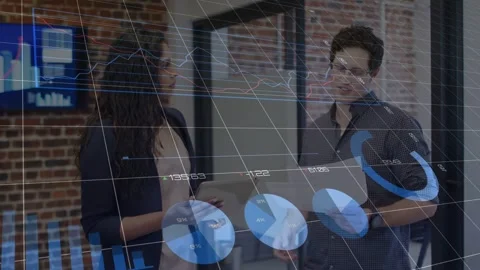 Analyst, manager pointing tablet, gesture causing data overlay animating finance Stock Footage 333539679