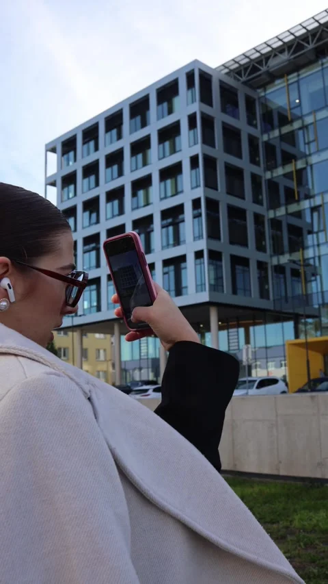 Analyst photographing office building Stock Footage 325453759