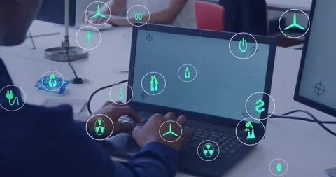 Analyst powering on laptop and typing while animating energy icons to Stock Footage 318115741