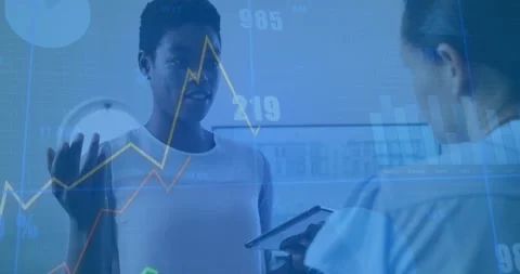 Analyst raising hand explaining business while assistant using tablet validating 库存影片 334040695