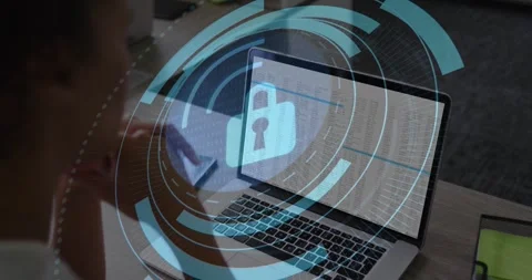 Analyst tapping tablet and verifying laptop data, animated security HUD forming, Stock Footage 330563781