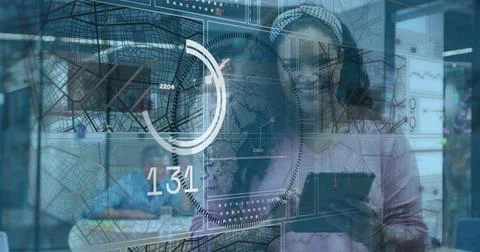 Analyst tapping tablet by glass, lighting HUD maps or rings, cycling values Stock Photos