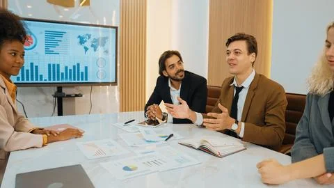 Analyst team utilize BI Fintech to analyze financial data in ornamented meeting Stock Photos