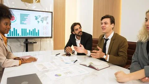 Analyst team utilize BI Fintech to analyze financial data in ornamented meeting Stock Photos