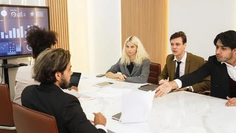 Analyst team utilize BI Fintech to analyze financial data in ornamented meeting Stock Photos
