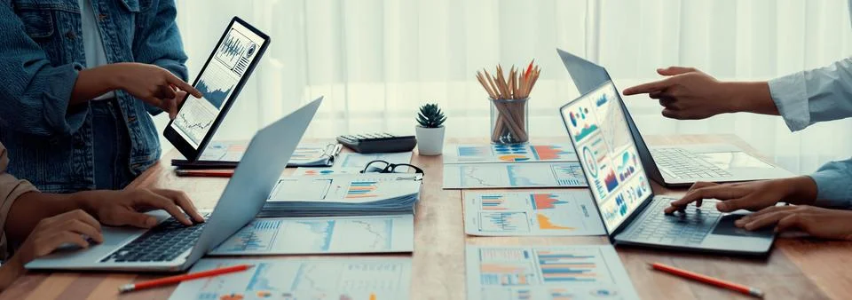 Analyst team utilizing BI Fintech to analyze financial report. Scrutinize Stock Photos