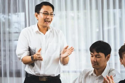 Analyst team utilizing BI Fintech to analyze financial data at table. Prudent Stock Photos