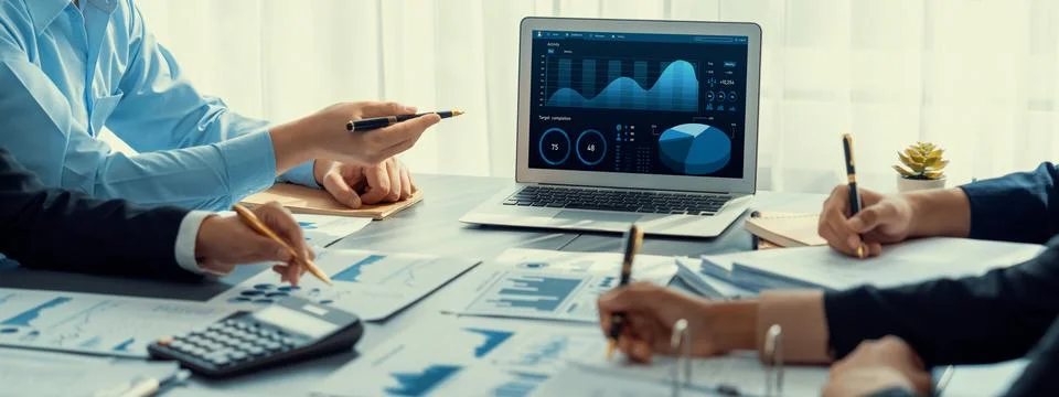 Analyst team working on data analysis dashboard on laptop screen. Insight Foto stock