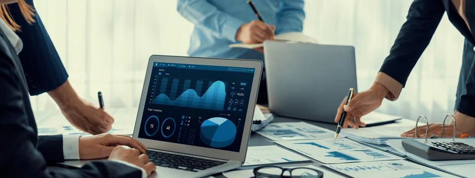 Analyst team working on data analysis dashboard on laptop screen. Insight Foto stock
