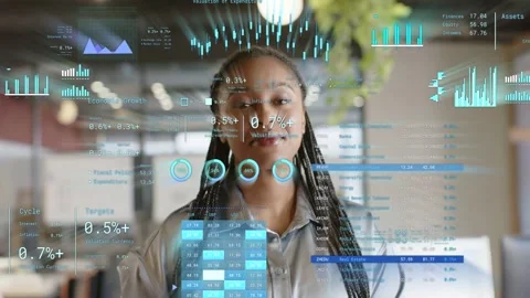 Analyst in tech office, reviewing data as AR charts appearing and shifting Stock Footage 333368262
